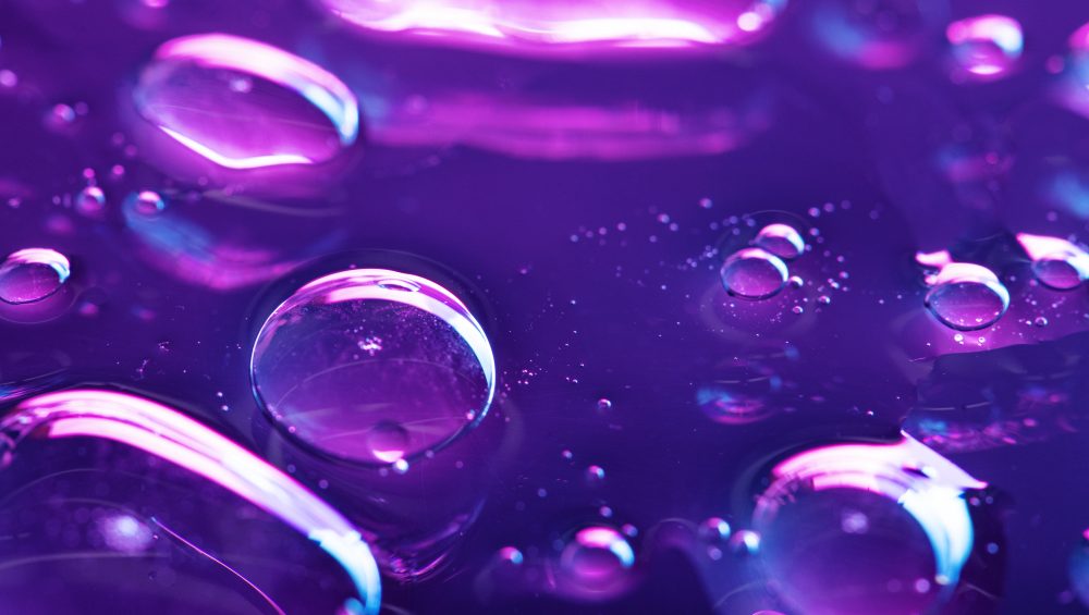 Abstract background image of neon coloured bubbles.