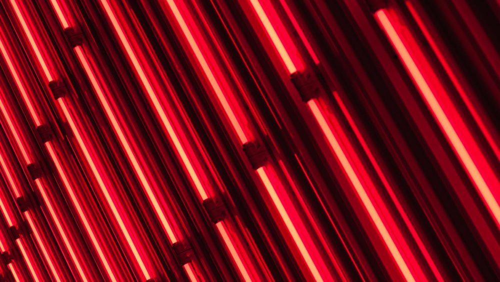 Diagonal red neon tubes.