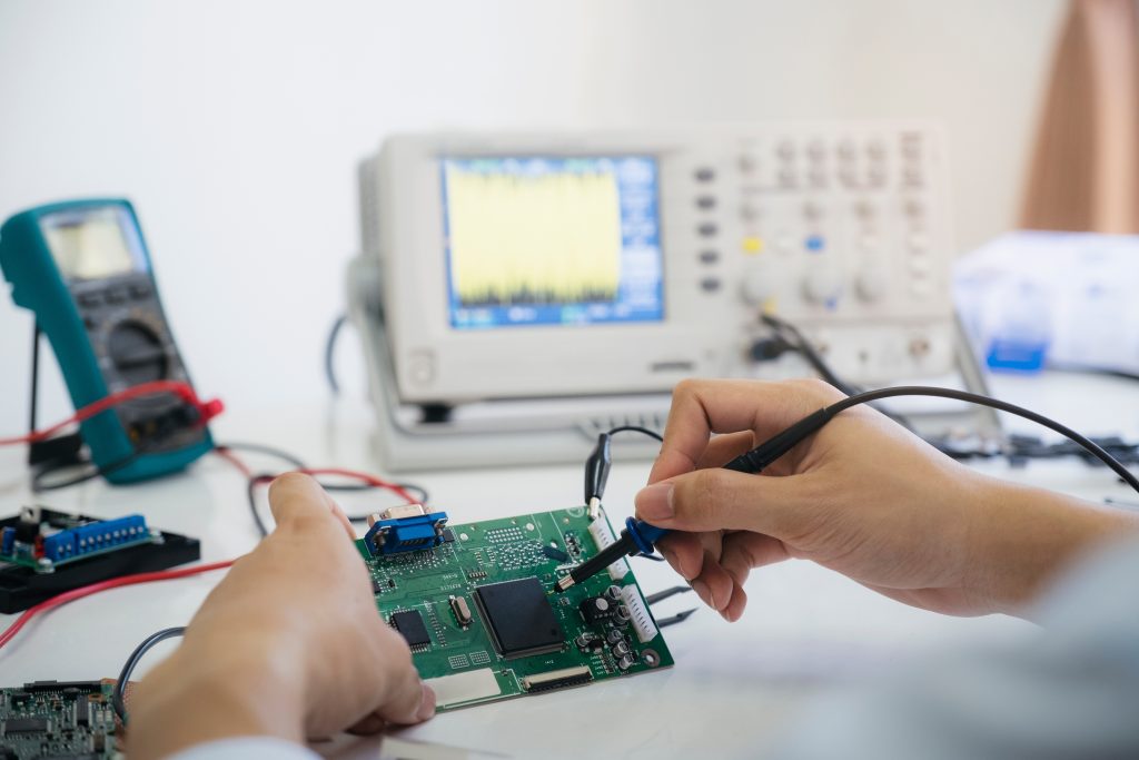 Cropped image of testing a circuit board.