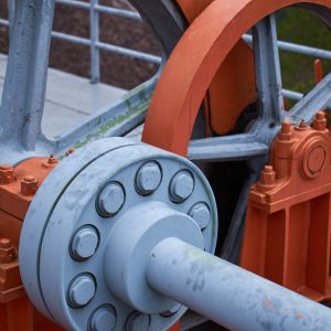 Close up of large mechanical wheels.