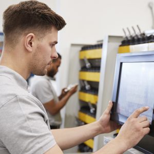 Engineer using electronic tool selection.