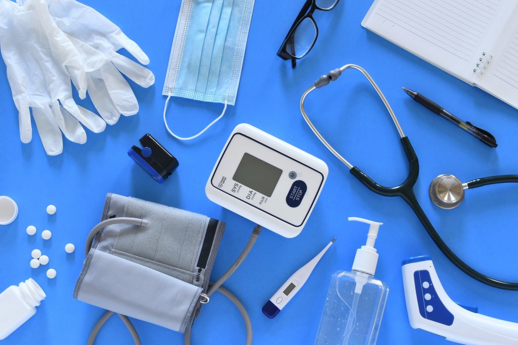 Various medical equipment on blue background.