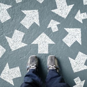 Feet in front of arrows on ground.