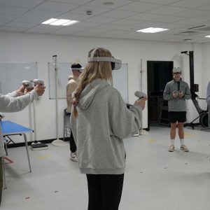 Students wearing virtual reality gear on Swansea University trip