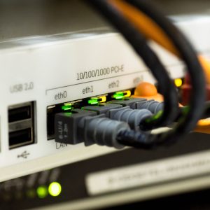 close up of back of router with network cables attached