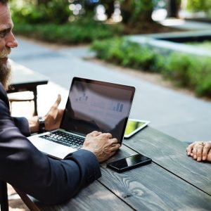 Two people meeting over a laptop