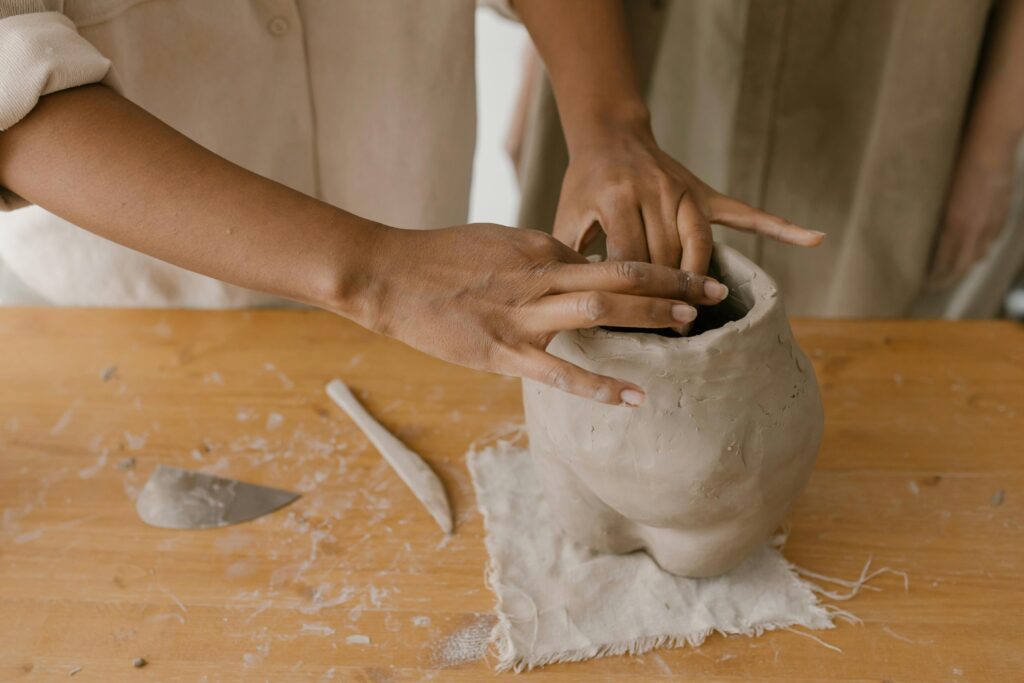 hands sculpting clay