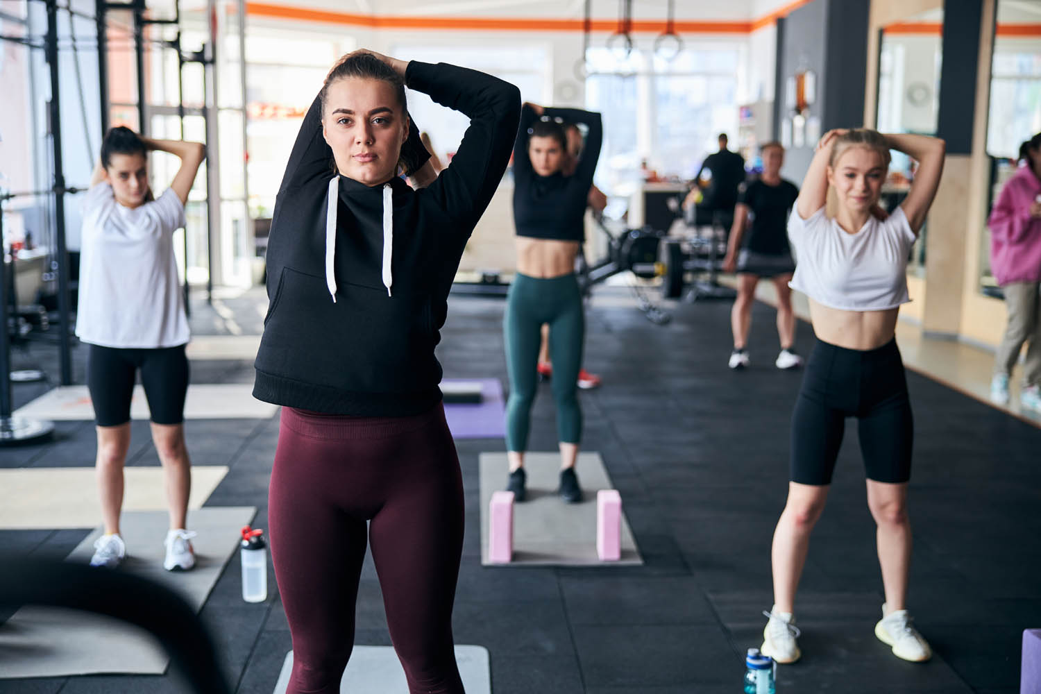Ladies exercising as a group at the gym
