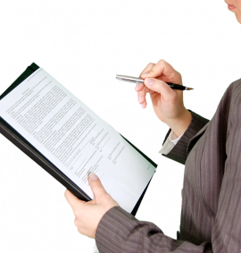 Person checking a document on a clipboard.