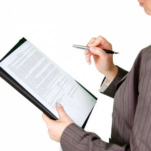 Person checking a document on a clipboard.