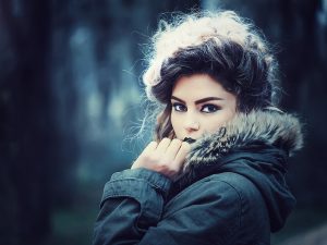 Woman with perfect make-up wearing fur coat.