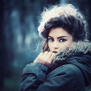 Woman with perfect make-up wearing fur coat.
