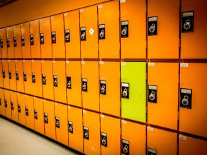 Rows of orange lockers and one yellow locker.