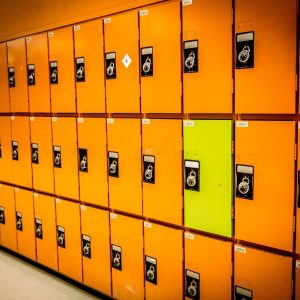Rows of orange lockers and one yellow locker.