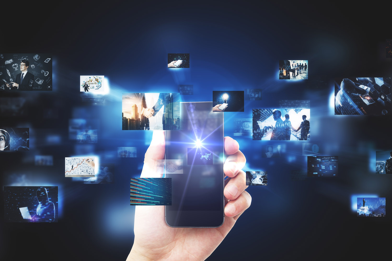 Hand holding a smartphone with digital pictures in background.