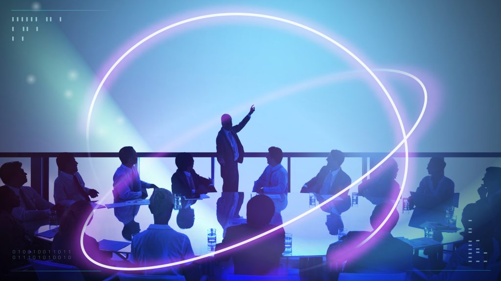 abstract neon lights over people in meeting background.