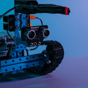 Close up photo of robot with tracks and claw