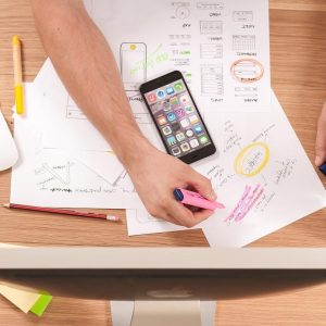 desk from above, highlighted areas, a phone and the top of a computer