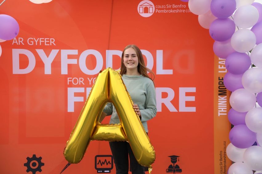 Jess holding an A.