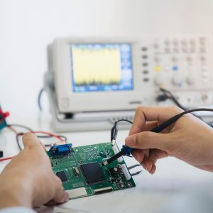 Cropped image of testing a circuit board.