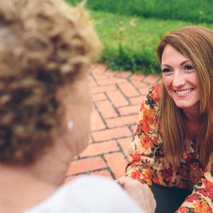 Woman talking in older woman.