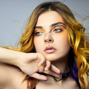 Model with creative hair and makeup.