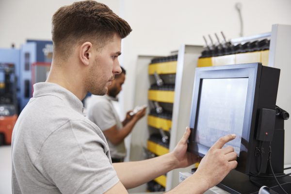 Engineer using electronic tool selection.