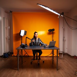 Woman in home studio for filming online content.