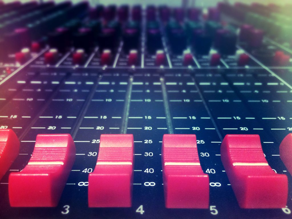 Close up of audio mixing desk.