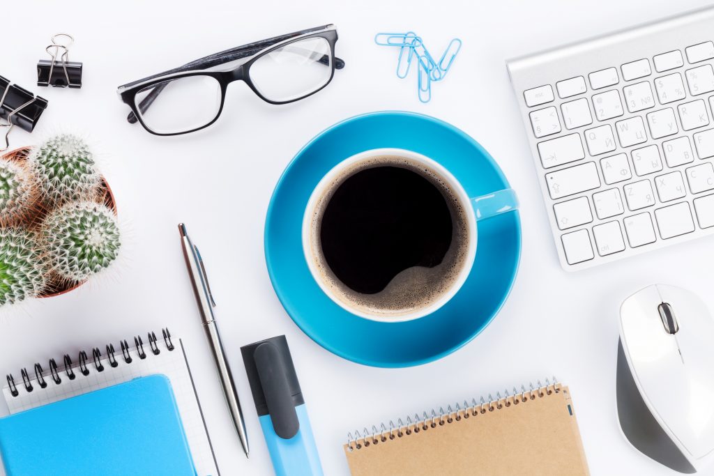 Office desk with various items in blue.