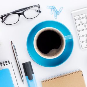 Office desk with various items in blue.