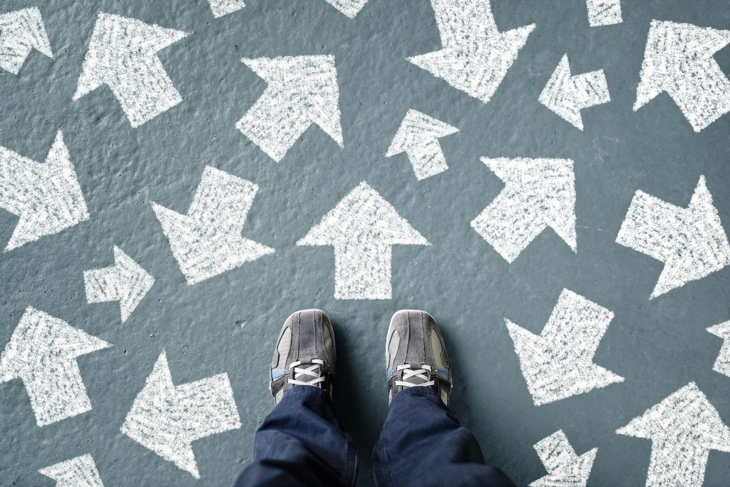 Feet in front of arrows on ground.