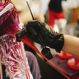 Close up of hair being coloured in salon.