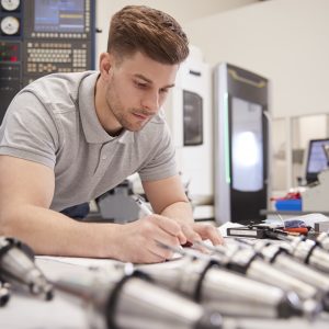 Man checking drawing in factory.