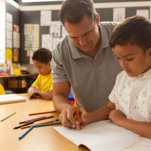 Man teaching child to write.