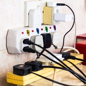 Multiple electricity plugs in adapters.