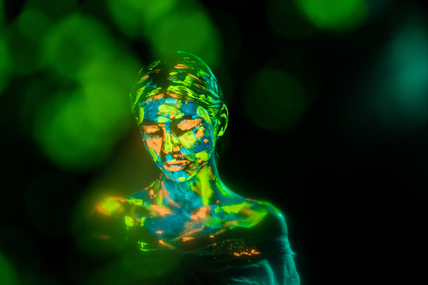 Person painted with bright neon paints