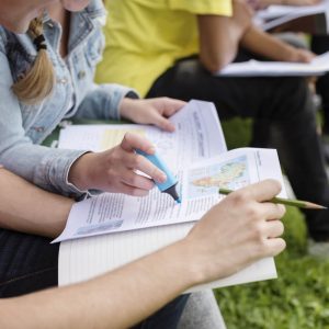 Cropped image of students studying information about Africa.