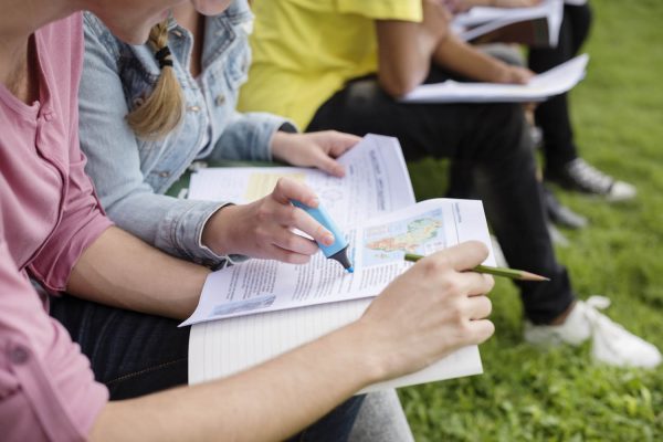 Cropped image of students studying information about Africa.