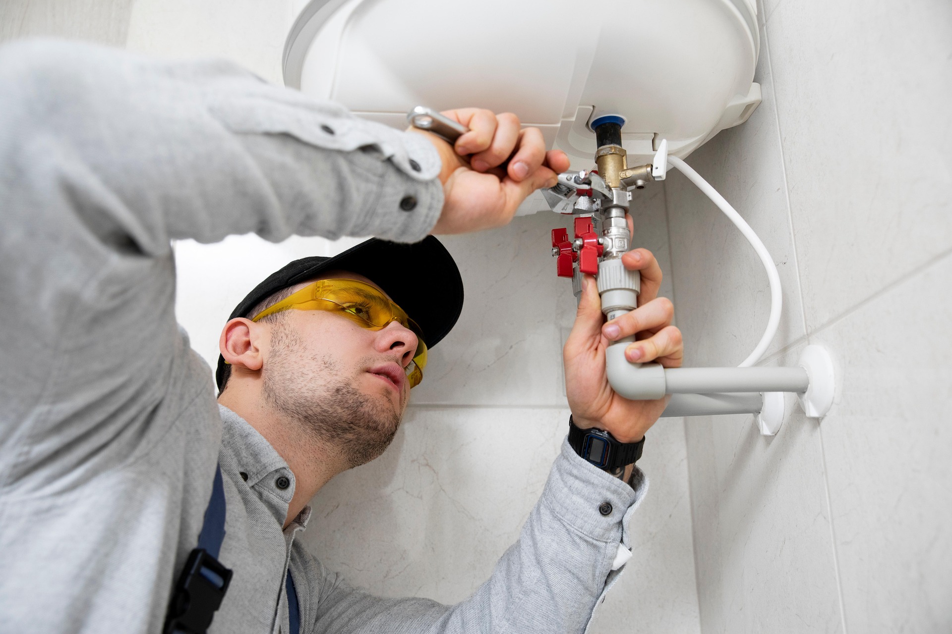 Plumber fixing a sink