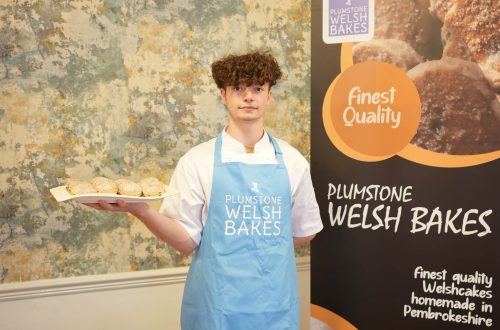 Tom holding plate of Welsh cakes.
