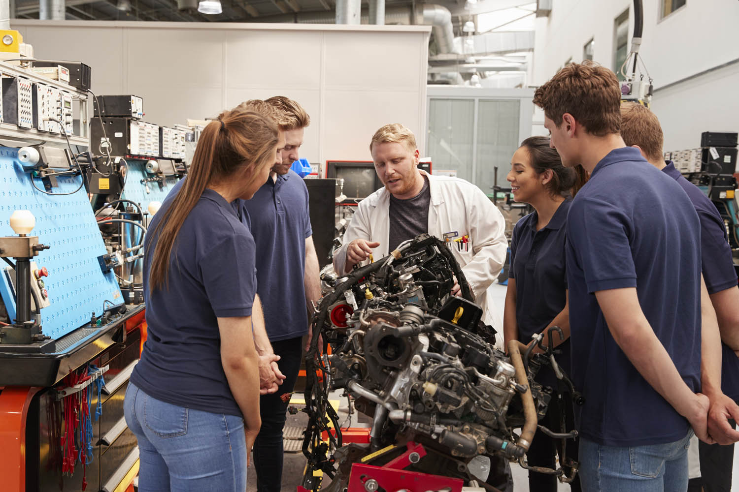 Lecture teaching learners in automotive workshop
