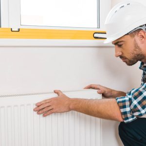 Plumber installing Radiator