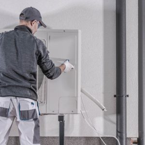 Man fixing air source pump