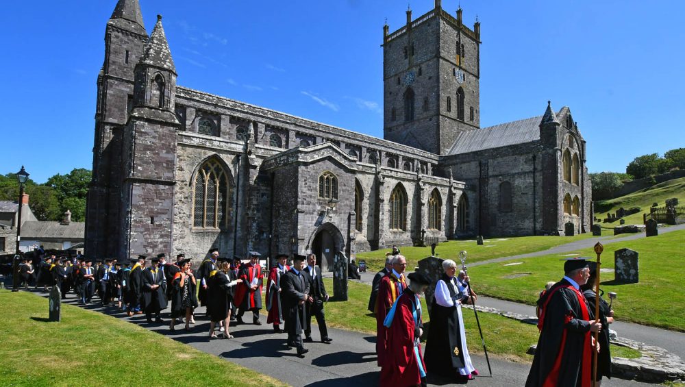 Staff and learners outside St Davids Cathedral for Graduation ceremony