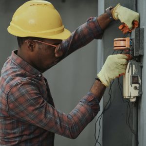 Man working on electrical box