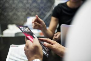 People looking at leaflet