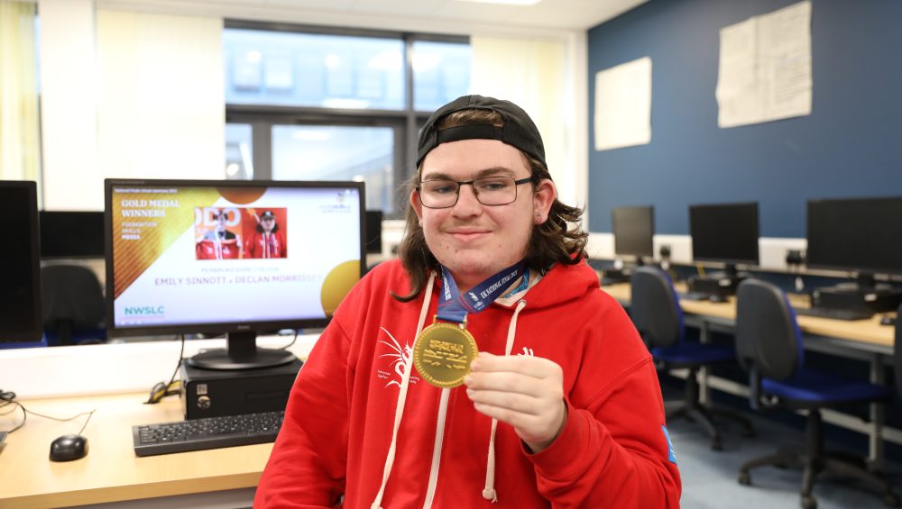 Declan holding a medal.