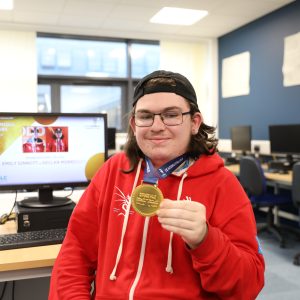 Declan holding a medal.
