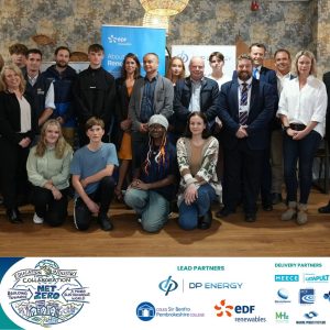 large group of learners and staff with banner at bottom containing logos and text: Destination Renewables